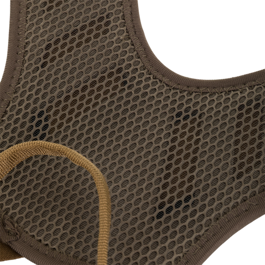 Close-up of olive green Kevlar mesh fabric with a brown elastic strap on a Drake X Ducks Unlimited BMF1600 Kevlar Wader.