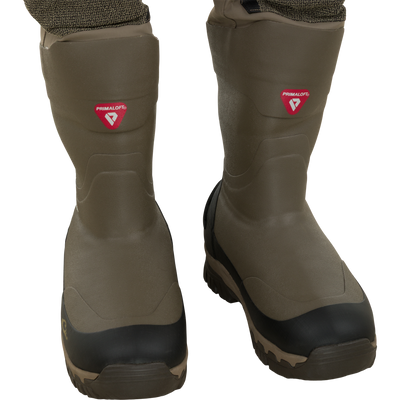 Olive green insulated rubber boots of the Waterfowl Drake X Ducks Unlimited BMF1600 Kevlar Wader, featuring black toe caps and Primaloft branding.