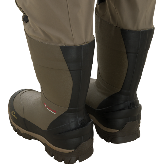 Rear view of tan Drake X Ducks Unlimited BMF1600 Kevlar Wader waterproof hunting waders featuring insulated rubber boots.