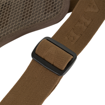Close-up of a brown strap with an adjustable black plastic buckle attached to the textured mesh panel of a Drake X Ducks Unlimited BMF1600 Kevlar Wader.