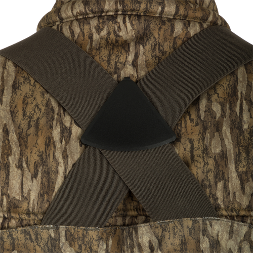 Insulated Guardian Elite Vanguard Breathable Waders - Realtree: A close-up of a vest with a black object on a brown fabric.