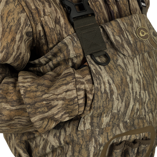 A close up of the Insulated Guardian Elite Vanguard Breathable Waders featuring pass-through internal handwarmer pockets to keep your hands warm and protected on even the coldest days.