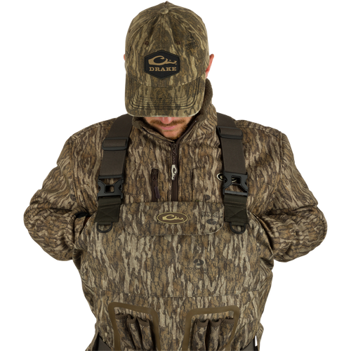 A man wearing the Insulated Guardian Elite Vanguard Breathable Waders.