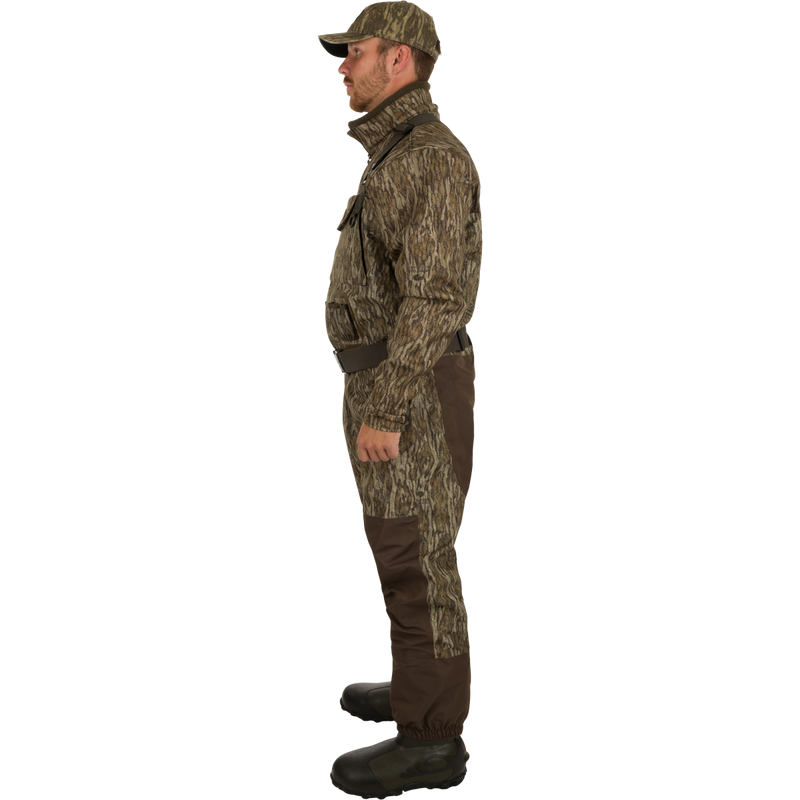 A man in camouflage outfit wearing Insulated Guardian Elite Vanguard Breathable Waders - Habitat, with close-ups of hand, boot, and head.