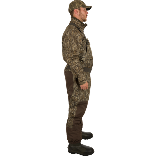 A man in camouflage clothing and hat wearing Insulated Guardian Elite Vanguard Breathable Waders - Realtree.