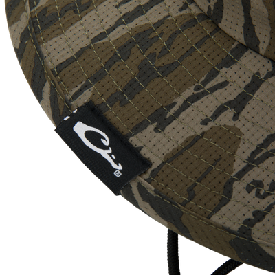 Drake Shoreline Boonie Hat with camo pattern, featuring micro vent holes, antimicrobial treatment, adjustable drawcord, and UPF 50 protection for breathable comfort.