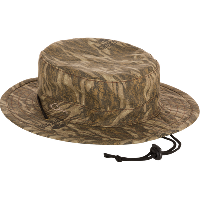 Close-up of the DUK Boonie Hat, featuring a full brim, adjustable drawstring, and lightly structured, soft cotton fabric for all-weather protection.