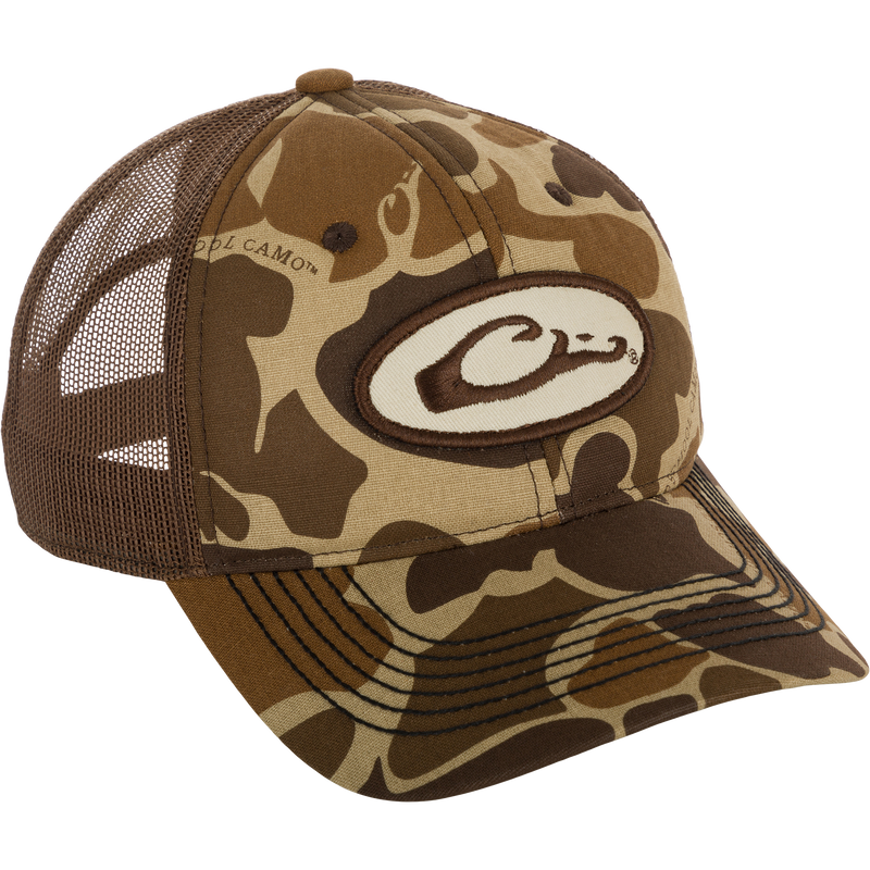 A brown hat with a camouflage design and a logo on it, featuring a foam-lined front and an adjustable closure. Perfect for everyday wear and outdoor activities.