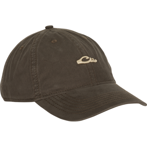 A brown baseball cap with a logo, crafted with 100% cotton twill, leather strap backing, brass buckle, and contoured bill.