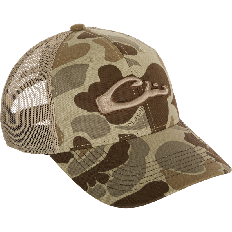 A 6-panel camo mesh-back cap made from 100% cotton. Features low-profile construction, lightly structured front panels, and a secure hook & loop back closure. Includes the Drake 