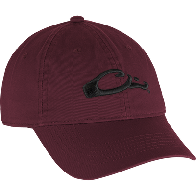 Cotton Twill Cap: A red hat with a black embroidered logo, featuring a low-profile design, brass buckle back strap, and contoured bill for comfortable, everyday wear.