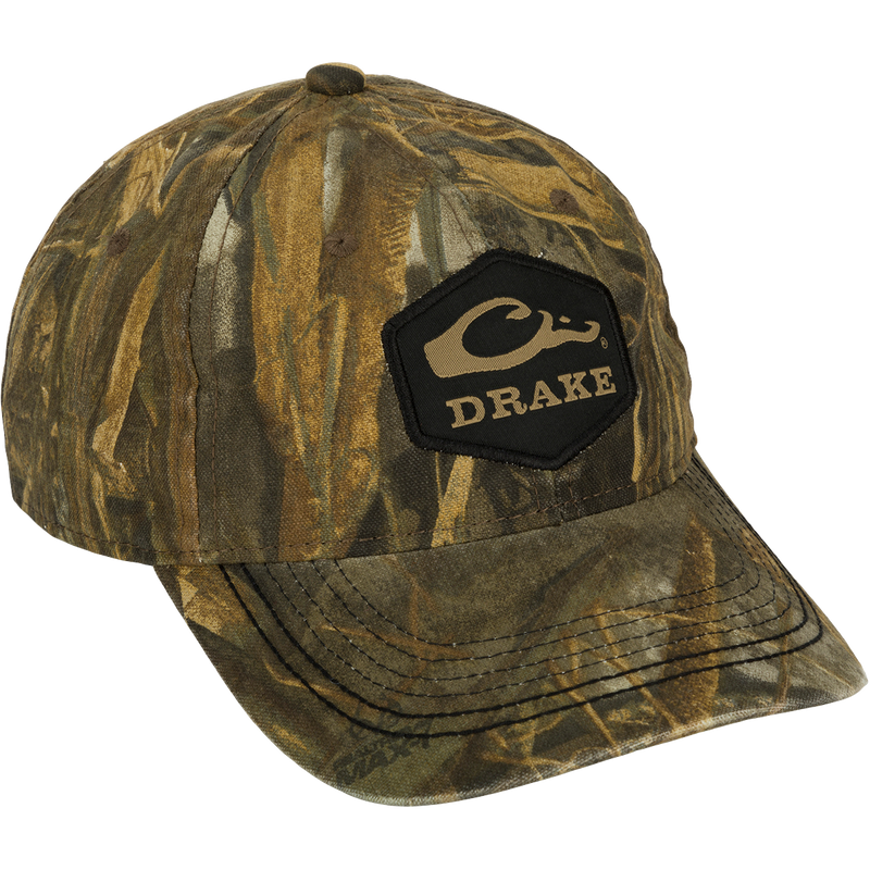 Camo Cotton Twill Hex Patch Cap - Realtree: A low-profile, unstructured hat with a logo patch. 60% cotton/40% polyester for durability. Hook and loop closure for a secure fit. Ideal for outdoor adventures.