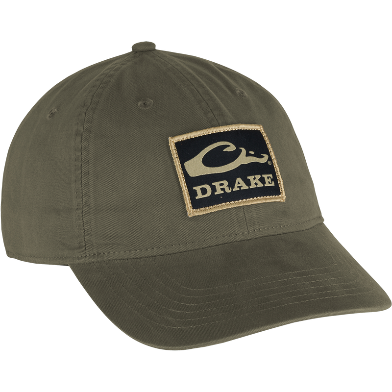 Cotton Twill Patch Cap with a green hat featuring a logo, low profile, contoured bill, and brass buckle back strap. 