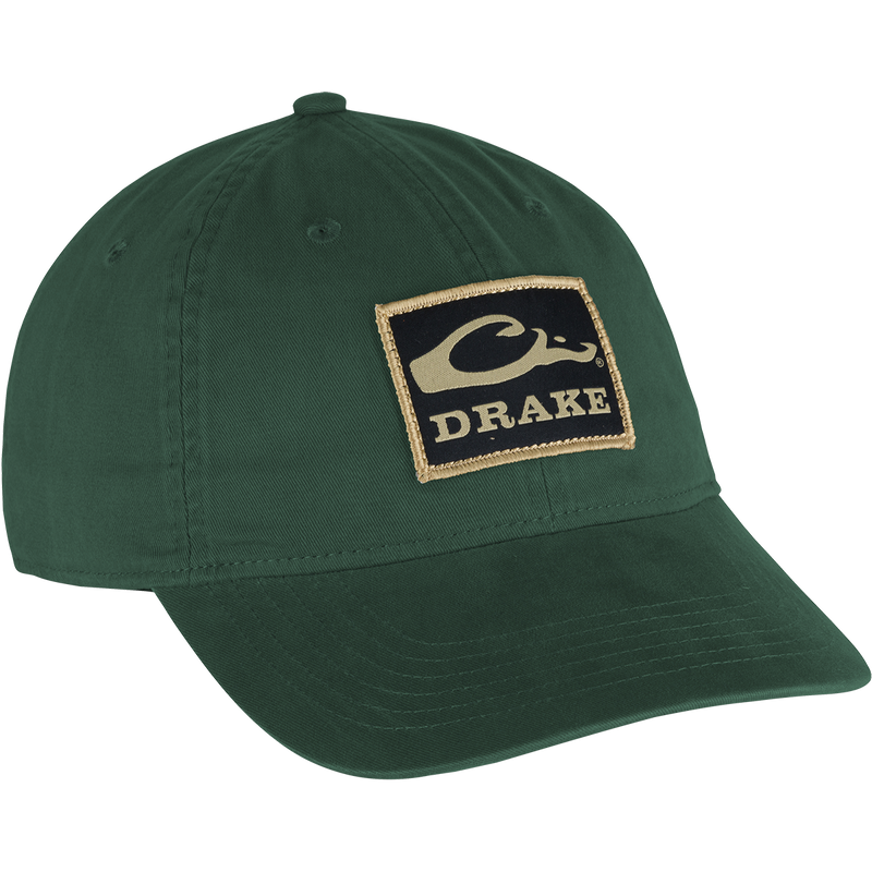 Cotton Twill Patch Cap - A low profile green hat with a logo on it. Crafted with 100% cotton twill, featuring a contoured bill and brass buckle back strap for a comfy fit. 