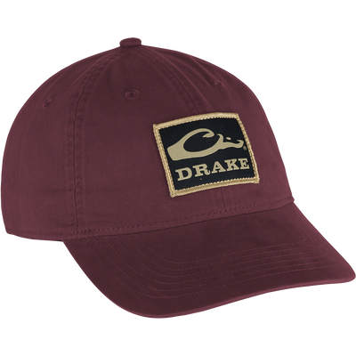 Cotton Twill Patch Cap featuring a logo, low profile, contoured bill, and adjustable brass buckle strap, crafted from 100% cotton twill for comfort and style.