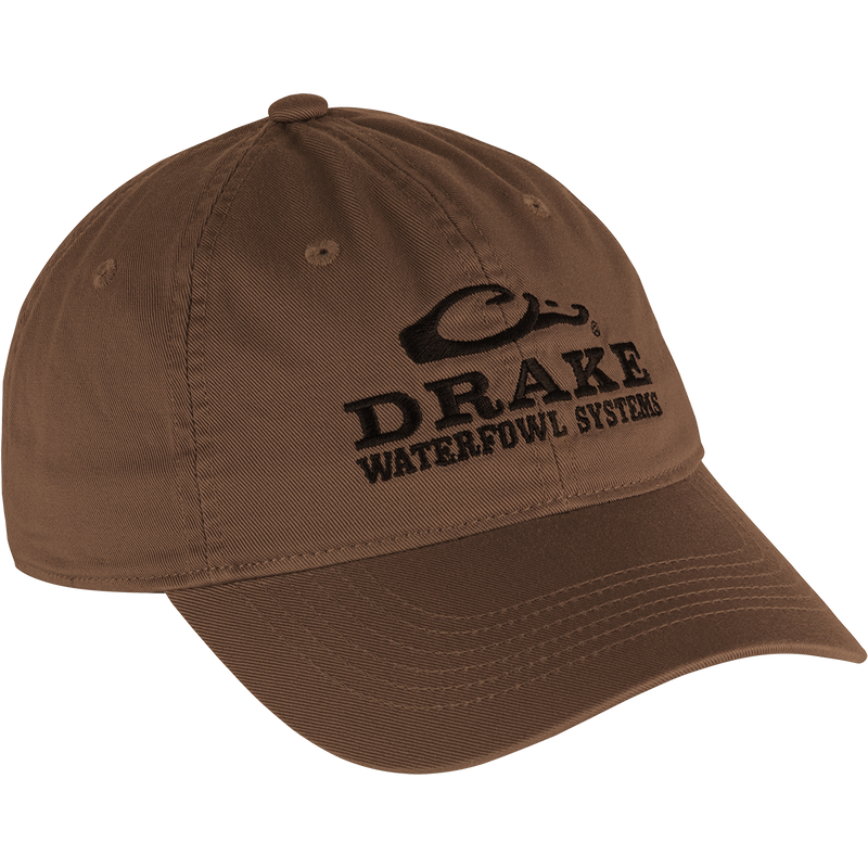 Cotton Twill Systems Cap - A low-profile brown hat with black text. Features a contoured bill and brass buckle backstrap for a snug fit.