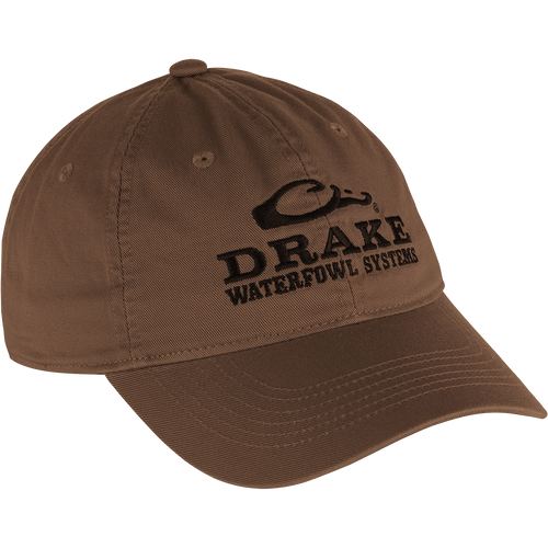 Cotton Twill Systems Cap - A low-profile brown hat with black text. Features a contoured bill and brass buckle backstrap for a snug fit.