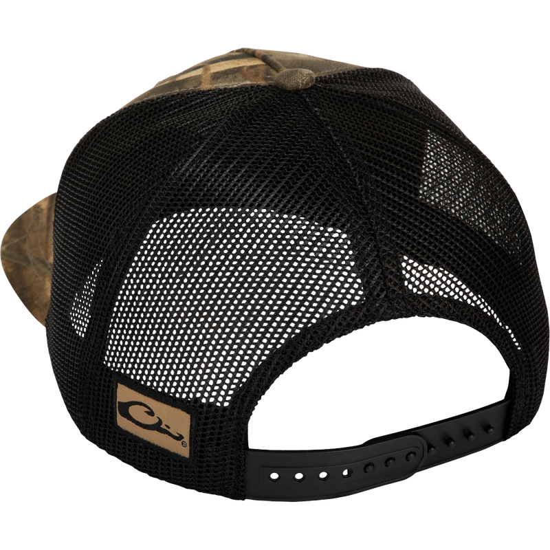 A black hat with a mesh back, featuring a logo close-up. Ideal for hunting and outdoor activities.