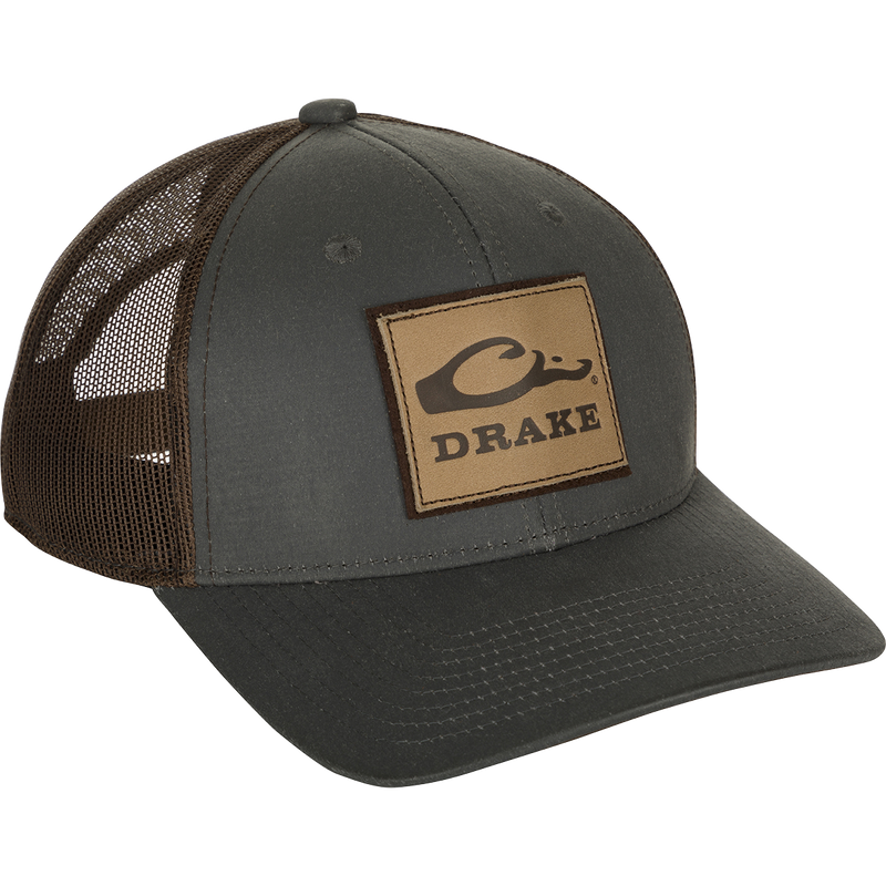 Leather Patch Mesh Back Cap with debossed Drake Logo on a weathered cotton/poly structured trucker hat. Comfortable and ruggedly handsome.