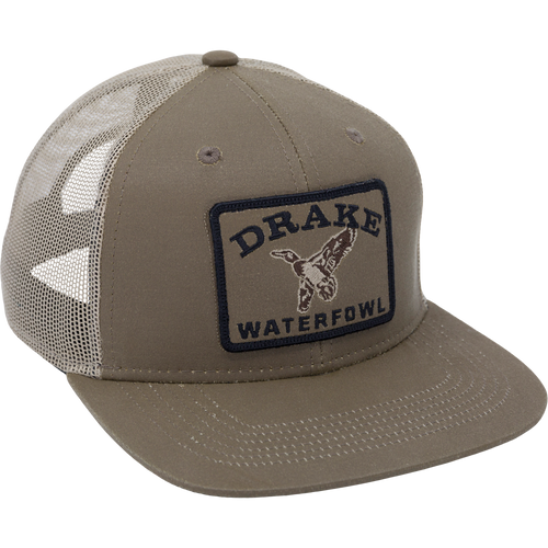 Duck Patch Mesh Back Cap features a structured crown, mesh back, and embroidered DRAKE WATERFOWL patch, ideal for waterfowl enthusiasts seeking durable, breathable headwear.