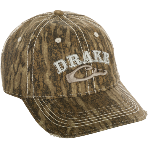 Distressed 6-Panel Ball Cap with frayed visor and raised Drake Logo embroidery on front panels. Cotton twill construction with adjustable closure.