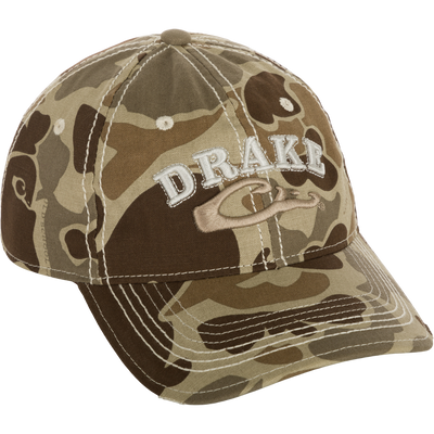 Distressed 6-Panel Ball Cap with raised Drake Logo embroidery, frayed visor, and contrast stitching. Cotton twill panels and adjustable closure.