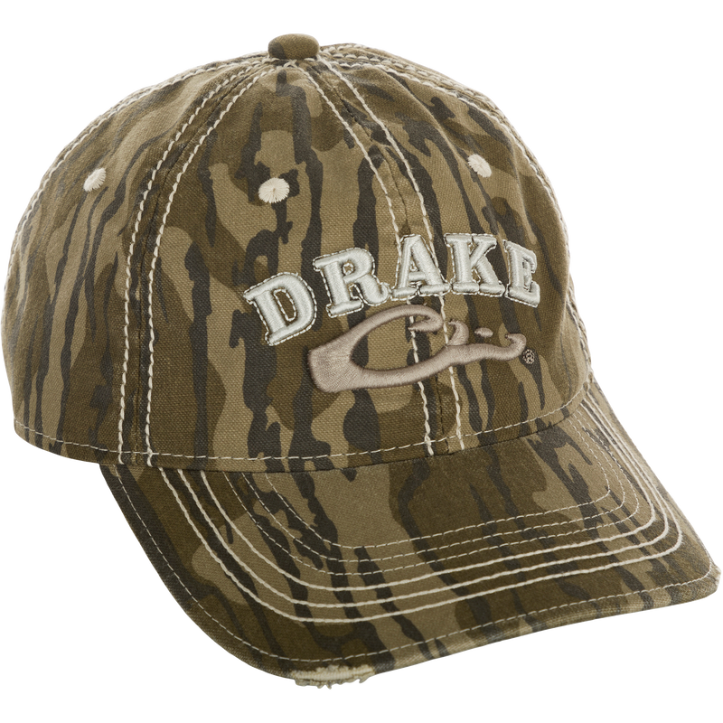 Distressed 6-Panel Ball Cap with camouflage pattern and Drake Logo embroidery, made of weathered cotton. Non-structured crown with frayed, pre-curved visor and contrast stitching. Adjustable hook and loop closure.