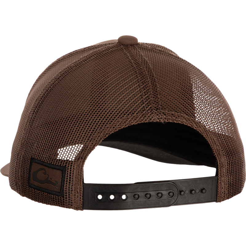 Drake Badge Logo Mesh Cap - A stylish brown hat with a black leather belt and logo detail. Made from durable cotton blend and polyester mesh. Adjustable snap back closure for a custom fit.