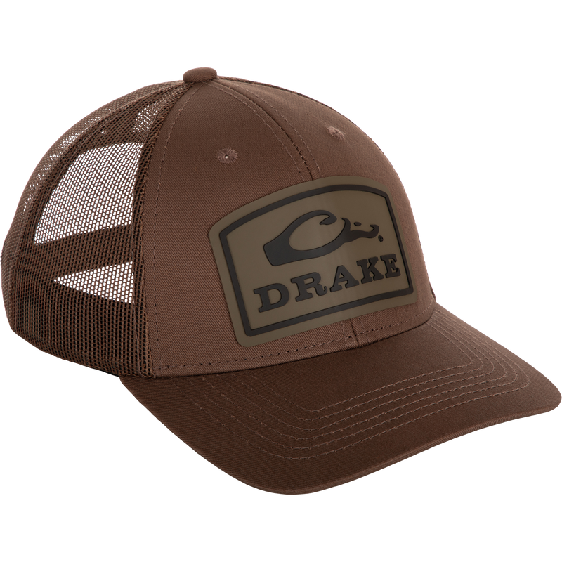 A brown Drake Badge Logo Mesh Cap with a logo on it.