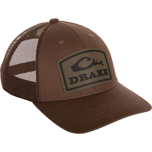 A brown Drake Badge Logo Mesh Cap with a logo on it.