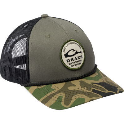 Drake Circle Badge Rope Cap with mesh back, featuring a logo patch, structured crown, flat bill, and adjustable snap-back, ideal for outdoor enthusiasts.