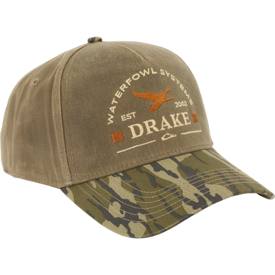 Drake X Lost Hat Coot Goat Rope Cap with olive-brown crown, camouflage visor, and embroidered logo, features mid-profile design and adjustable snapback for waterfowl enthusiasts.