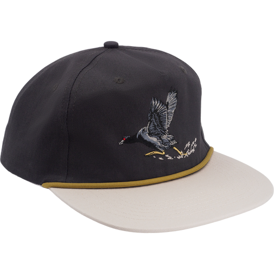 Drake X Lost Hat Coot Goat Rope Cap featuring a dark crown, light beige brim, and embroidered waterbird, perfect for waterfowl enthusiasts.
