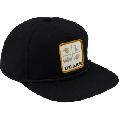 Black Drake X Lost Hat DDTF Goat Rope Cap with a flat brim and a snap-back closure, featuring a patch with four icons of a bird, a dog, a truck, and a football above the text DRAKE.