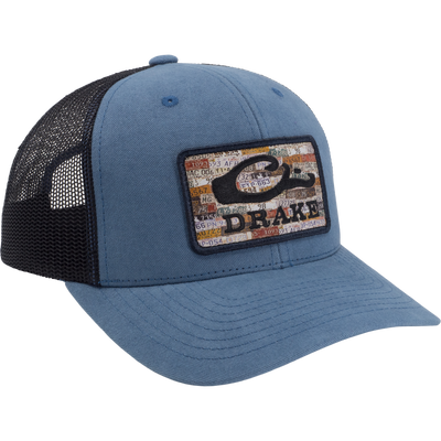 Drake License Plate Mesh Back Cap featuring a foam front with a collage patch, black mesh back for breathability, and adjustable snap closure for a perfect fit.