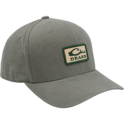 Drake Throwback Dad Cap featuring an olive six-panel design with a curved brim, embroidered Drake patch, and adjustable snap closure for comfort and durability.