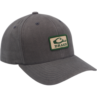 Drake Throwback Dad Cap with a green-outlined DRAKE patch, featuring a six-panel design, curved visor, and adjustable snap closure for comfort and style.