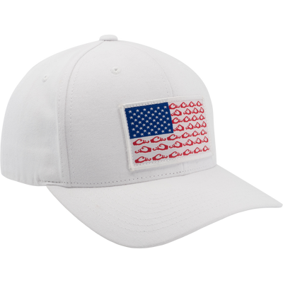 Drake Americana Dad Cap featuring a U.S. flag-inspired front patch on a white, six-panel cotton twill design with adjustable snap closure for a comfortable fit.
