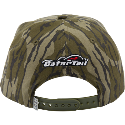 Back view of Drake x Lost Hat MBRGA Hybrid Patch Goat Rope Cap, showing olive-green camouflage, snap-closure, and Go for it! embroidered patch above the opening.