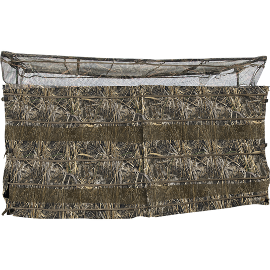 A close-up of the Ghillie 4-Man Blind with No-Shadow Dual Action Top, featuring a net and a wall of hay.