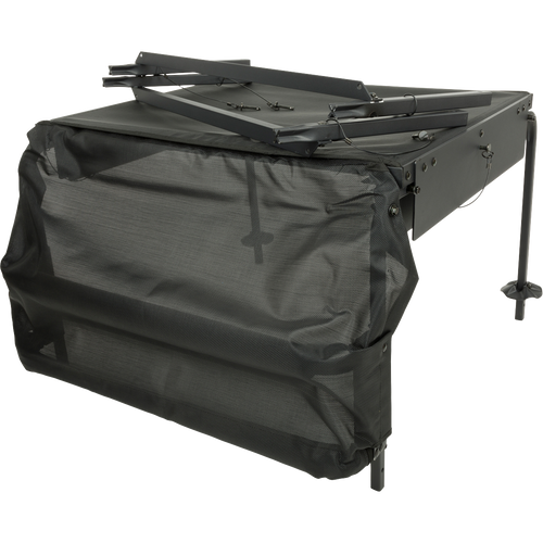 A black table with a mesh cover, part of the Ghillie Deluxe Platform for duck hunters and their retrievers. Stable and versatile, it features a 5-inch mesh-topped platform and extension legs. Perfect for field use.