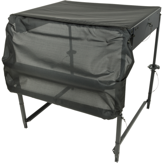 A black square object with a black cover, the Ghillie Deluxe Platform, a 34" tall platform with extension legs and a 5" mesh-topped platform. Stable and versatile for your retriever in the field.