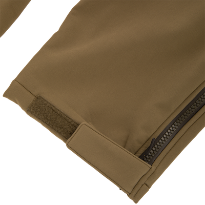 Close-up of the Non-Typical Statix Fleece Lined Bib, showcasing textured ripstop fabric, coil zipper, and Velcro tab, designed for warmth and durability in harsh conditions.