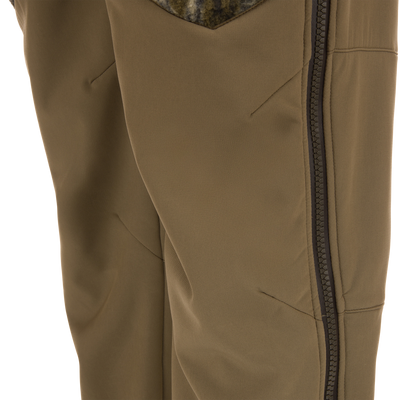 Close-up of the Non-Typical Statix Fleece Lined Bib, showcasing a zip-up jacket with angled pockets, ideal for extreme cold with PrimaLoft® insulation and waterproof features.