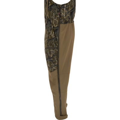 Non-Typical Statix Fleece Lined Bib with Agion Active X2, featuring camouflage fleece top, solid soft-shell legs, full-length side zipper, and durable waterproof design for extreme cold hunting conditions.