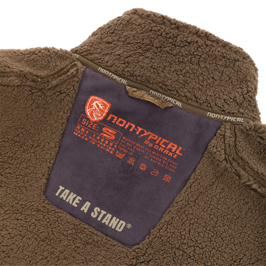 Inside collar label of the Midweight Nova Silencer Vest with Agion Active X2, showing brand, size, care instructions, and functional features for outdoor enthusiasts.