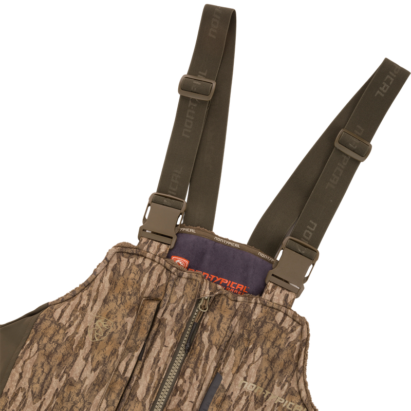 Midweight Nova Silencer Bib with Scent Control, featuring adjustable shoulder straps, front zipper, chest pocket, and NonTypical branding, designed for warmth, breathability, and silence in hunting.