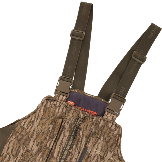 Midweight Nova Silencer Bib with Scent Control, featuring adjustable shoulder straps, front zipper, chest pocket, and NonTypical branding, designed for warmth, breathability, and silence in hunting.