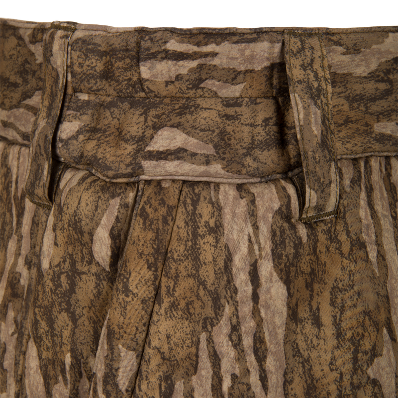 Midweight Nova Silencer Pant with Scent Control featuring camo fabric, pleated design, and a stretch waistband for enhanced mobility, ideal for hunting with anti-odor and water-resistant technologies.