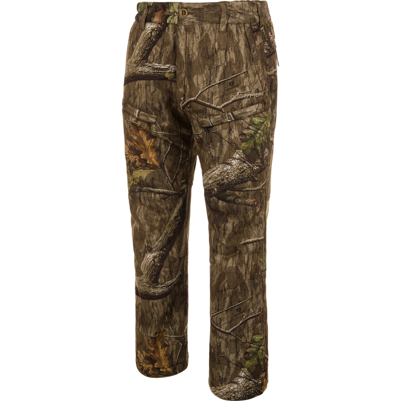 Midweight Nova Silencer Pant with Scent Control in woodland camouflage, featuring durable, water-resistant fabric with anti-odor technology, stretch waistband, and multiple zippered pockets for enhanced hunting mobility.